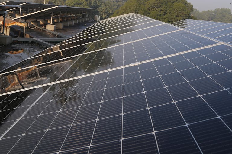 Wide view of solar panels on a rooftop in Lahore, promoting clean energy and sustainability.
