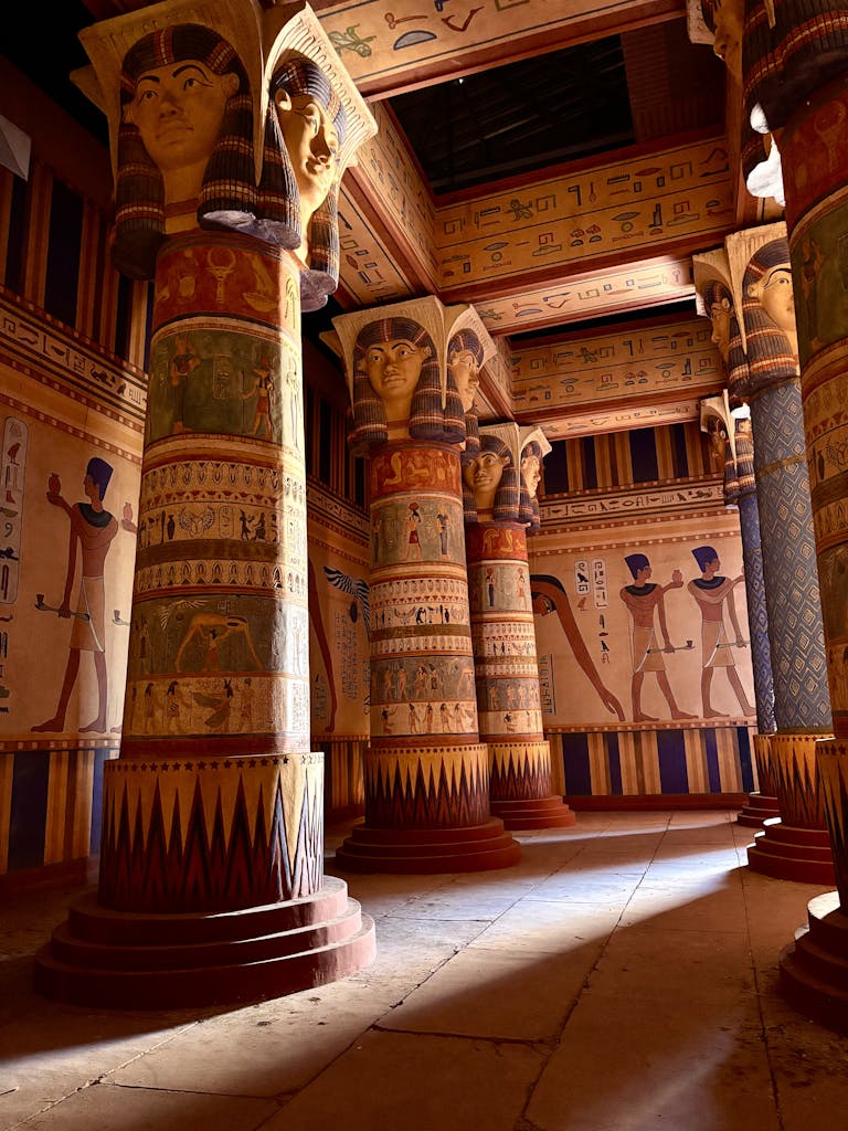 Captivating view of a historic Egyptian temple interior showcasing hieroglyphics and vivid artwork.