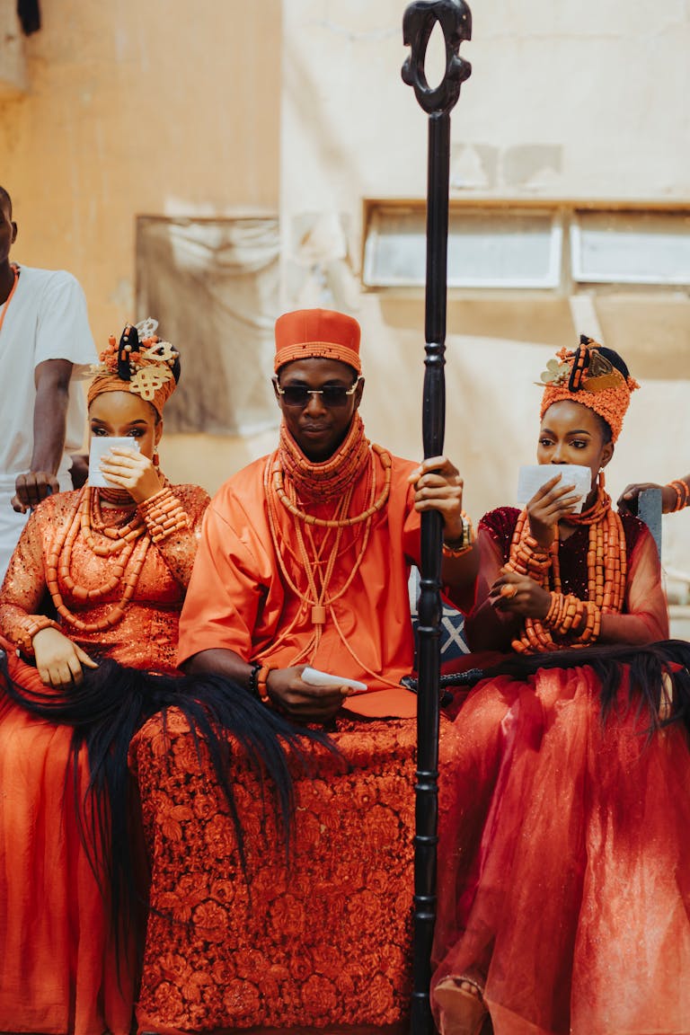 Vibrant traditional African royal ceremony with rich cultural attire and ornaments.